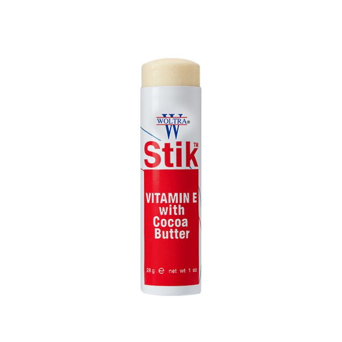 An uncapped 1 ounce tube of Woltra Vitamin E Stik Cocoa Butter with exposed tip