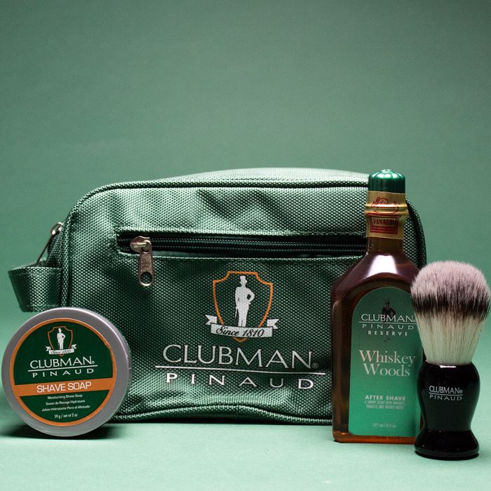 Clubman Shave Essentials Dopp Kit Bag flanked by Whisky Woods Shave Lotion, Shave Brush, & Shave Soap