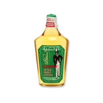 Front view of  a clear 6 ounce bottle of Clubman Pinaud After Shave Lotion showing its amber colored liquid conttents